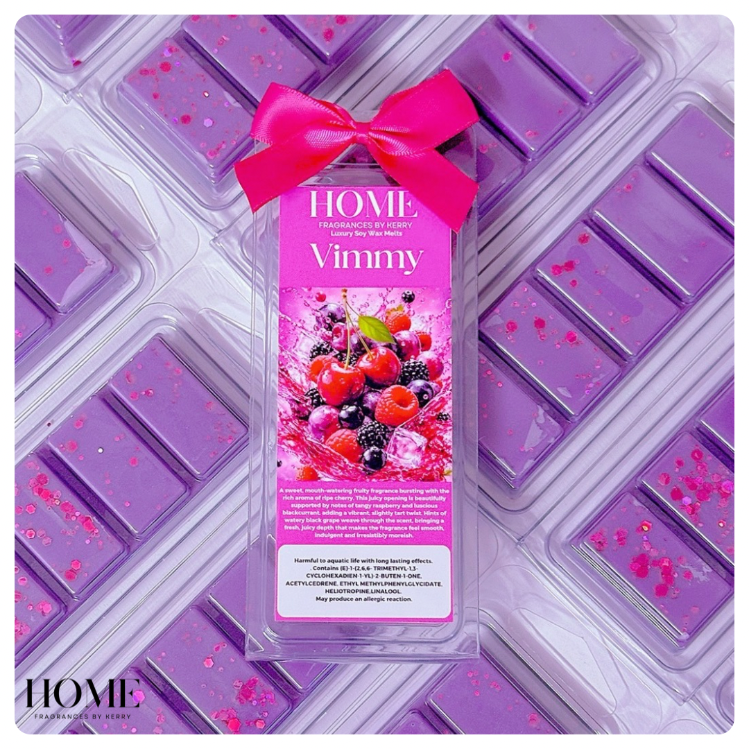 Purple wax melt mold with a pink bow and 'HOME' branding on a matching purple background.